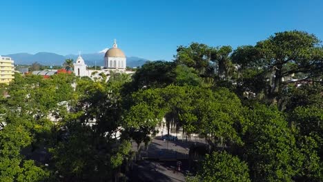 view-of-the-citlaltepec-volcano-from-a-drone-rising-through-the-trees-in-Cordoba,-Veracruz,-Mexico