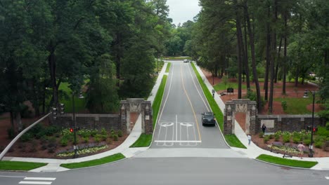 Proud-family-parents-takes-photos-of-student-at-entrance-of-Duke-University