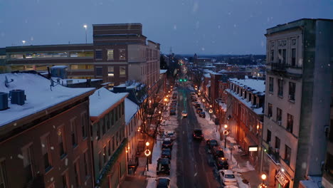 Winter-snow-in-urban-downtown-city-decorated-for-Christmas