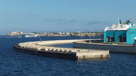 Large-view-:-Balearia-Fast-Boat-entering-inside-the-port-of-Ciutadella-in-Menorca-island-during-summer