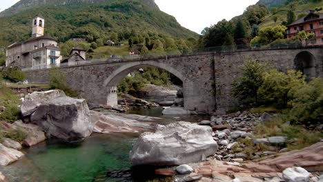 FPV-aerial-drone-footage-along-river-to-Lavertezzo,-Switzerland