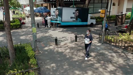 wide-angle-of-doctor-actor-talking-to-people-in-front-of-public-square