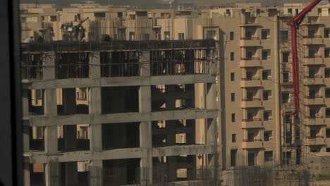 Apartment-Building-Construction-Development-With-Cement-Crane-Reveal-In-Background