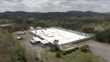 Aerial-Drone-Footage-Dollying-Forward-Over-an-Abandoned-National-Standard-Factory