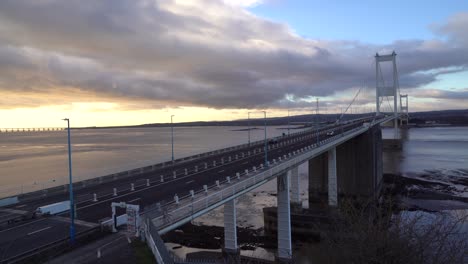 Traffic-crosses-the-Severn-Bridge-linking-England-with-Wales-near-to-Bristol,-UK