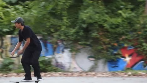 Boys-practice-skateboarding-in-an-abandoned-building-in-Denpasar,-Bali,-October-25,-2021