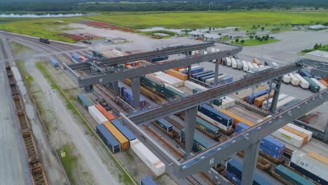 4K-Drone-Video-of-Trains-and-Trucks-at-CSX-Intermodal-Train-Yard-in-Winter-Haven,-FL