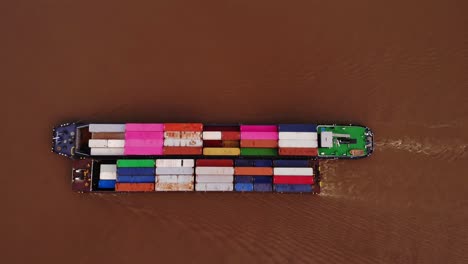 Aerial-Looking-Down-Over-Excelsior-Cargo-Ship-Paired-With-Barge-Carrying-Cargo-Containers-Along-River-Noord