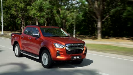 Malaysia,-March-13,-2022:-4x4-Isuzu-D-Max-pick-up-truck-driving-fast-on-the-toll-road