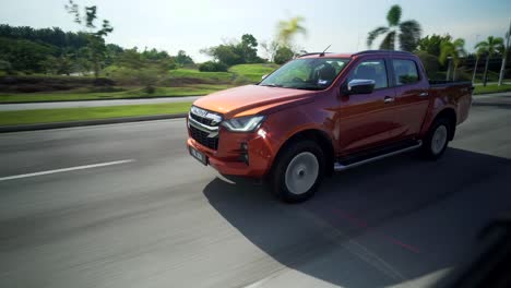 Malaysia,-March-13,-2022:-4x4-Isuzu-D-Max-pick-up-truck-driving-fast-on-the-toll-road