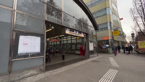 People-coming-out-of-a-subway-station-in-Vienna,-Austria,-Europe,-moving-shot