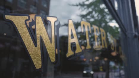 Water-st-cafe-front-front-sign-store-front-on-glass-on-fixed-angle