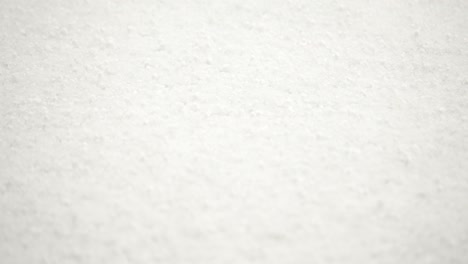 Close-up-Hail-on-a-garden-table-in-the-UK