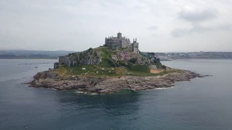 Aerial-orbits-historic-Cornwall-UK-island-castle,-St-Michael's-Mount