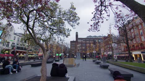 Rembrandtplein-square,-wide-static-shot,-overcast-evening,-Amsterdam,-Netherlands