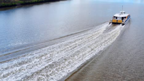 CityCat-Ferry-Transport-Leaving-Wake-On-Brisbane-River-In-The-City-Of-Brisbane,-Queensland,-Australia