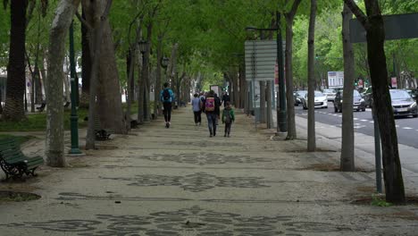 Man-on-scooter-on-the-pavement-of-Avenida-da-Liberdade-in-Lisbon