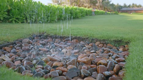 Close-up-of-a-beautiful-gravel-pit-at-a-tropical-resort-with-green-grass-around-in-beautiful-sunshine