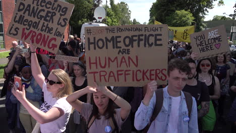 Protestors-hold-up-various-handmade-cardboard-placards-and-chant-on-a-protest-against-the-first-flight-to-Rwanda-to-deport-migrants-deemed-by-the-government-as-illegal