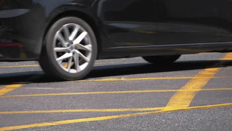 Slow-motion-shot-Cars-Driving-In-Asphalt-Road---Low-angle