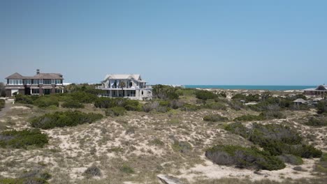 Two-stories-seafront-properties-along-Bald-Head-Island-Beach