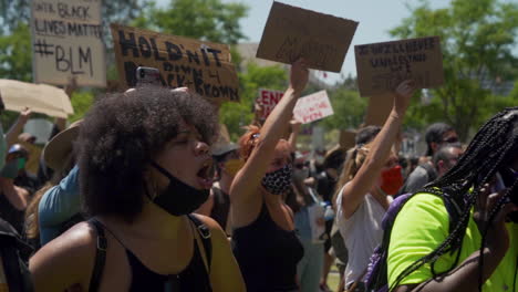 A-Black-Woman-chants-along-with-a-crowd-of-BLM-protesters-outside-City-Hall