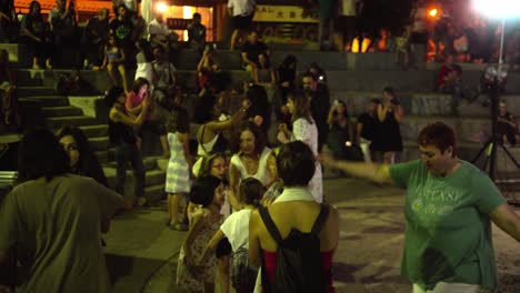 People-dancing-at-a-music-festival-concert-in-Athens,-Greece