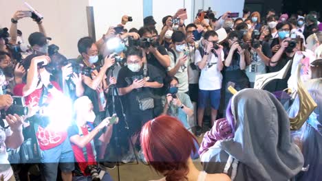 Visitors-take-photos-as-participants-dressed-up-cosplayers-are-posing-during-the-Ani-com-and-Games-ACGHK-exhibition-event-in-Hong-Kong