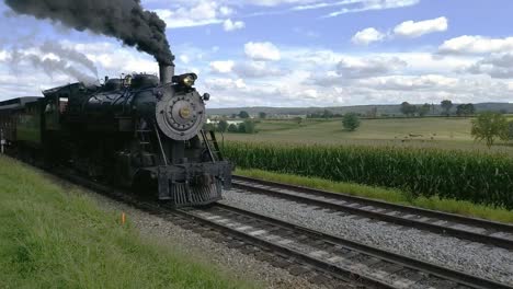 Steam-Train-Pulling-out-of-Picnic-Area-Along-Amish-Farmlands