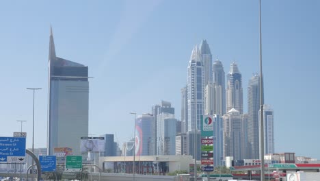 Driving-on-a-street-in-dubai-next-to-dubai-marina-and-huge-skyscrapers