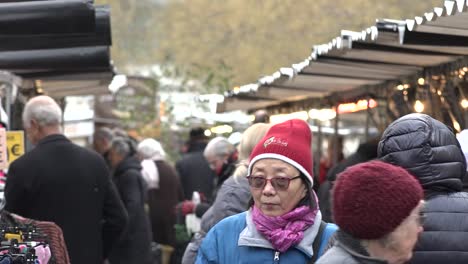 French-people-shop-along-an-open-market-in-the-centre-of-Paris,-France,-11-01-19