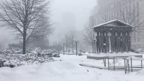 Snowfall-covers-Pillars-of-Justice-Sculpture,-Toronto