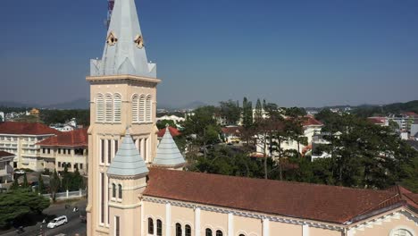 Drone-shot-of-mini-Eiffel-tower-and-church-spire-in-Da-Lat-or-Dalat-in-the-Central-Highlands-of-Vietnam-on-sunny-day