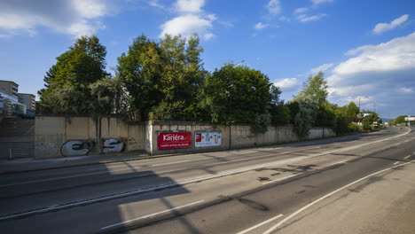 Time-Lapse-footage-of-Žilina-City-daytime-traffic-environment-with-cars-and-people-moving-by