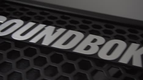 Slow-slide-from-right-to-left-over-black-Soundboks-speaker-logo