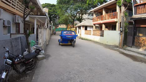 interior-street-in-El-Nido,-ticycle-ride