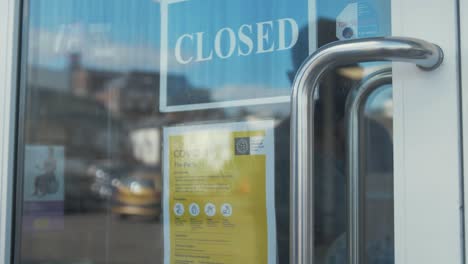 Man-tries-door-of-closed-shop-during-pandemic-outbreak