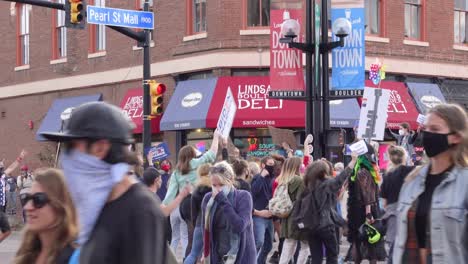 People-celebrating-Joe-Biden's-election-victory-in-the-streets-of-Boulder,-Colorado