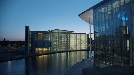 Illuminated-Government-District-in-Berlin-at-Night-next-to-River-Spree