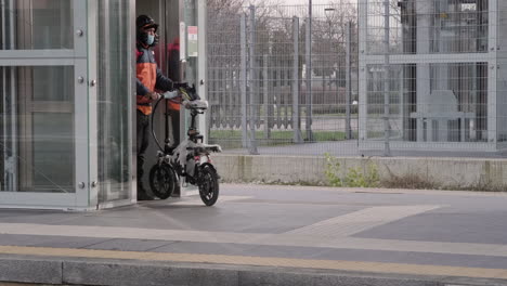 Food-Raider-Coming-Out-from-Elevator-to-Wait-a-Train-on-the-Platform-at-the-Station