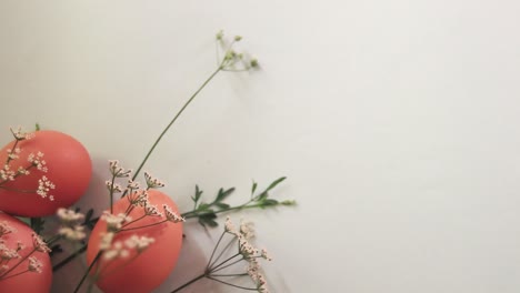 Rack-focus-on-eggs-and-dainty-flowers-arrangement-to-create-a-Spring-and-Easter-theme-background