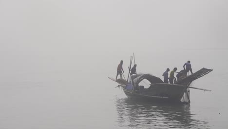 Bangladeshi-fishermen-pulling-nets-from-the-river-water