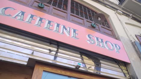 Caffeine-Shop-Facade-With-Pink-Sign-Banner