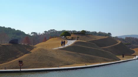 Visitors-of-Lake-Garden-Walking-Exploring-walkways-of-Haeryeong-Hill-in-Suncheonman-Bay-National-Garden,-Suncheon-South-Korea