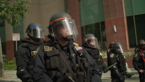 8-Police-CHP-officers-lined-up-at-a-protest-during-the-day-in-front-of-the-city-hall-building