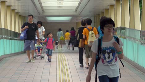 People-Crossing-Through-Causeway-Road-Bridge-In-Hong-Kong