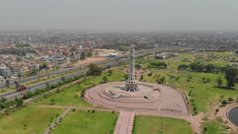 Aerial-View-Of-Minar-E-Pakistan-Monument-With-City-View-In-The-Background