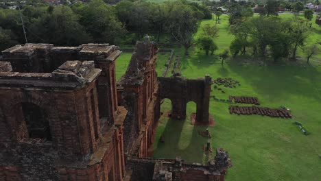 Orbiting-aeril-view-of-the-ancient-bell-tower-of-the-Jesuit-church,-Sao-Miguel-Missoes