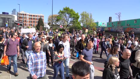 People-walk-past-Blackfriars-on-a-protest-against-the-UK-wide-lockdowns