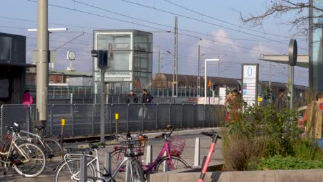 Establishing-Shot-Gamlestaden-Tram-and-Train-Station,-People-walking-by,-Gothenburg---Slow-motion